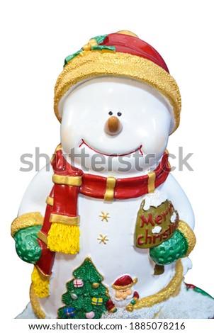 Smile snowman in snow wearing red hat and scarf.Smile snowman in snow wearing  green glove.snowman doll with"merry chrismas" word on white background with clipping path.