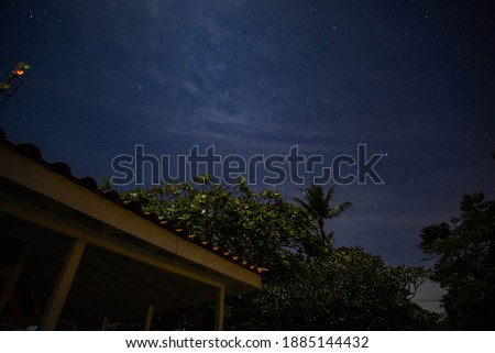 Night sky with clouds and a shooting star 