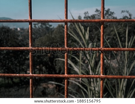 picture of fence caught up with rust.