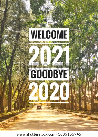 Phrase Welcome 2021 Goodbye 2020 on nature background. 