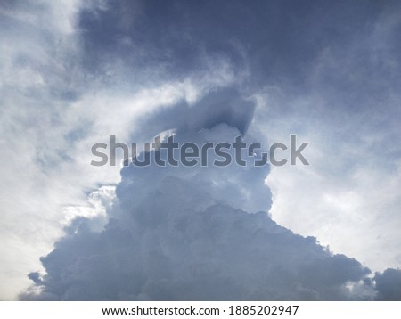 Picture of large clouds and black shadow colors