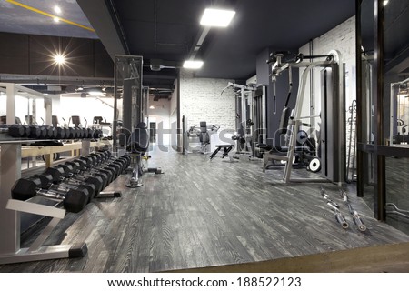Modern gym interior with equipment  Royalty-Free Stock Photo #188522123