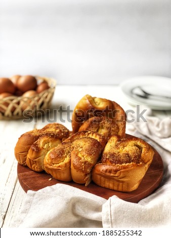 Roti kepang durian or Braided bread with durian fruit flesh filling is sweet and delicious,on wooden table background