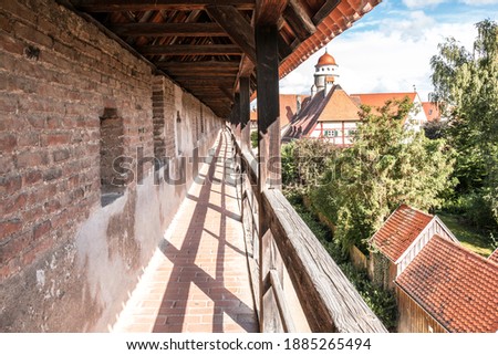 Big medieval city wall around the medieval town Royalty-Free Stock Photo #1885265494