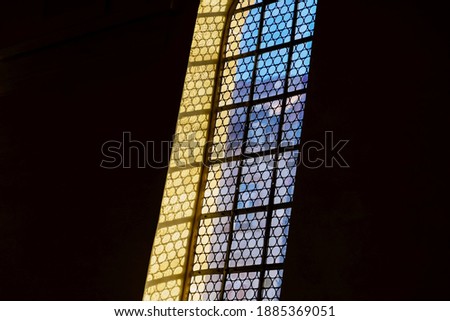 Beautiful old window in the german catholic church, black background