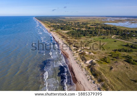 Aerial view of Pape between Baltic sea and Lake Pape. Blue sky. Pape lighthouse