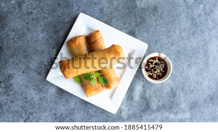 deep fried spring rolls, Por Pieer Tod or Fried spring rolls (Thai Spring Roll) Snacks and snacks that are popular with Thai and Chinese people. Royalty-Free Stock Photo #1885415479