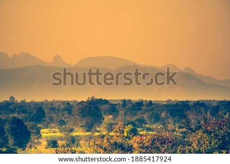 landscape view hills or mountain layer photo and forest on sunset silhouette background, beautiful sunset scenic nature, golden light sunny on sky background on many hill, abstract beautiful nature.
