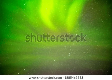 Beautiful northern lights aurora borealis against the background of the starry sky