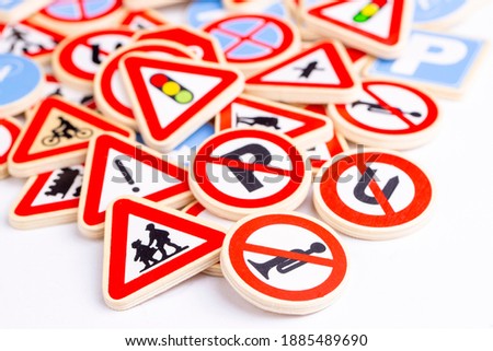 Different colored traffic signs on the white background