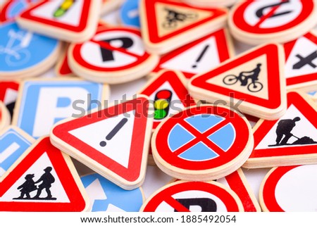 Different colored traffic signs on the white background