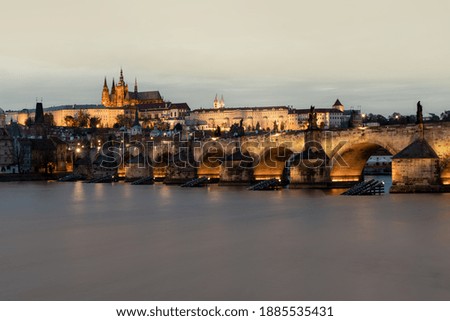 
Prague Castle and Charles Bridge and illuminated street lighting