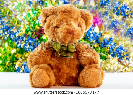 Cute toy teddy bear, Xmas gift for kids. A present on Happy New Year Party.