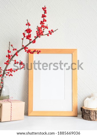 Style Christmas decor and blank frame. Mock up for Christmas design. Copy space. Front view