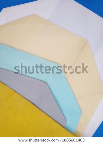 Nonwoven Polypropylene Spunbond Blue Fabric with different colors Texture background. This Fabric Can be Use for ECO Friendly Bags Making.