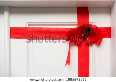 Red ribbon on white wooden door decor Christmas ornament for hush door ornament Macro shot great background image Modern Architecture buying