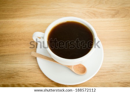 Black coffee on wooden table
