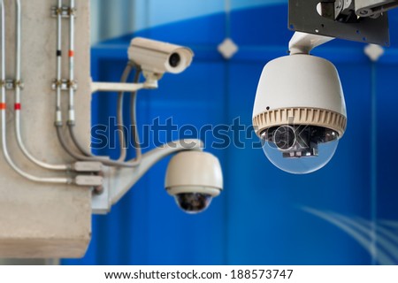 3 CCTV camera or surveillance operating on blue background