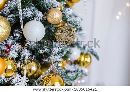Christmas tree decorated with colorful balloons and garlands..