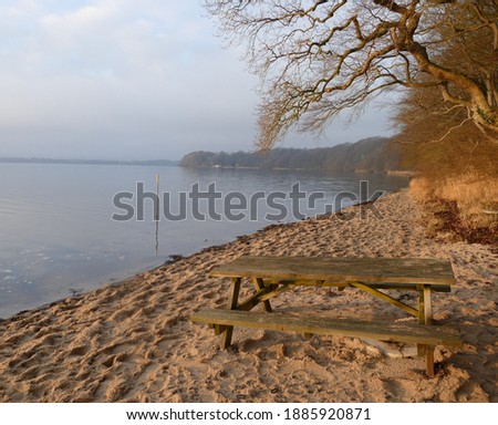 Bench on beach at shore