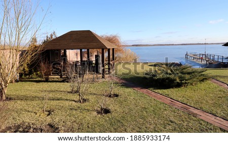 summer cottage in winter with barbecue, boat, pier for fishing and rest. Beautiful, well-groomed lawns, plants and flowers prepared for wintering