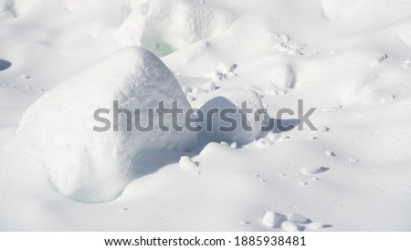 Perfect snow surface in winter. Shiny white snow. Winter dunes. Snow level. Real natural snowball