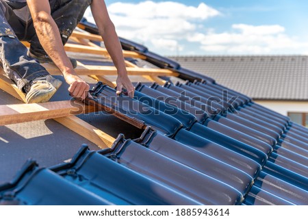 production of roofs from ceramic fired tiles on a family house Royalty-Free Stock Photo #1885943614