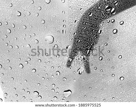 Rain droplet on glass surface