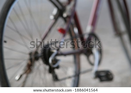 A blur of a bicycle parked on the road