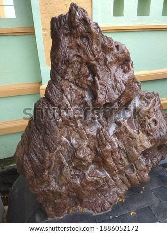 
an artificial stone art with brown colour
