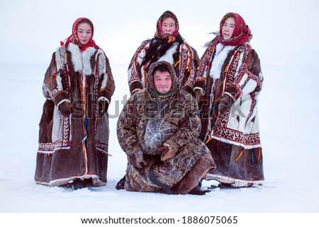 Yamalo-Nenets Autonomous Okrug, extreme north, Nenets family in the national winter clothes of the northern inhabitants of the tundra, the Arctic circle Royalty-Free Stock Photo #1886075065