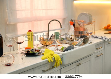 Dirty dishes in kitchen after new year party