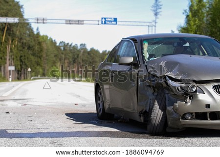 Traffic Accident Resulting in a Crushed Car Royalty-Free Stock Photo #1886094769