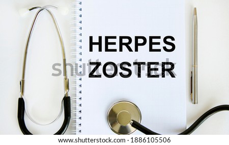 In the notebook, the herpes zoster tects, a pen and a stethoscope nearby.