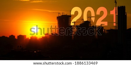 sunset from back side of construction area silhouette with 2021 concept