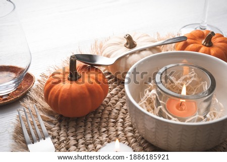 Autumn table setting with pumpkins on white background