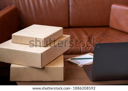 Cardboard box package for delivery in living room. work from home and small business concept.