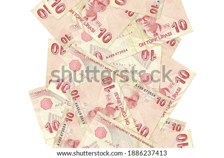 10 Turkish liras bills flying down isolated on white. Many banknotes falling with white copy space on left and right side