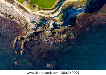 Aerial view of the rocky coast and cliffwalk of Newport, Rhode Island. Royalty-Free Stock Photo #1886360005