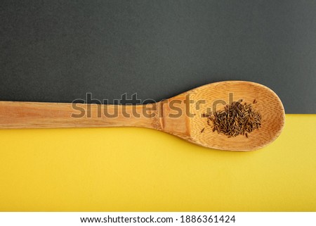 Top view of spices on grey and yellow background. Flat lay
