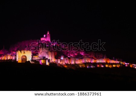 Tsarevtes hill illuminated in different colors during Sound and Light show on a winter night