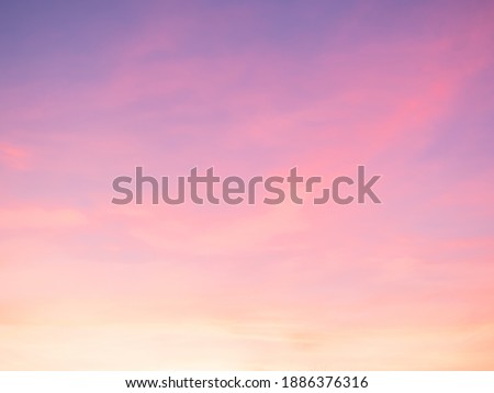 Majestic dusk. Sunset sky twilight in the evening with colorful sunlight. Pastel colors. Abstract nature background. Moody pink, purple clouds sunset sky with long shutter Royalty-Free Stock Photo #1886376316
