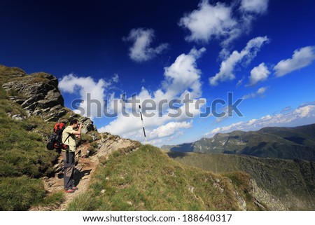 Nature photographer taking photos in the mountains