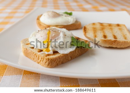 Poached eggs on white plate