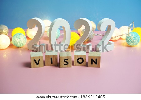 Vision 2022 word alphabet letters on pink and blue background