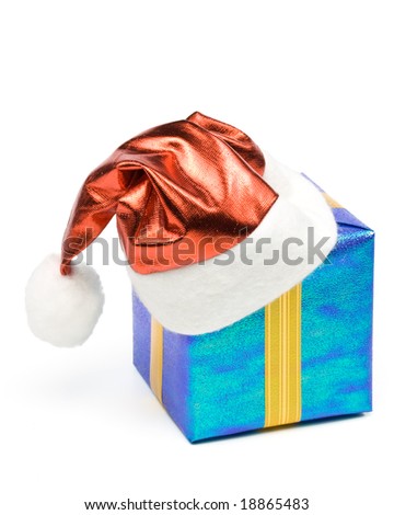 Santa's red hat and gift box on a white background