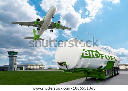 Airplane and biofuel tank trailer on the background of airport. New energy sources Royalty-Free Stock Photo #1886551063
