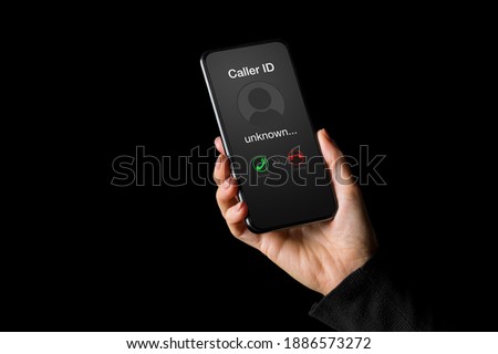 Person receiving call on phone from an unknown caller Royalty-Free Stock Photo #1886573272