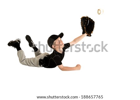 Young baseball player sliding to catch ball