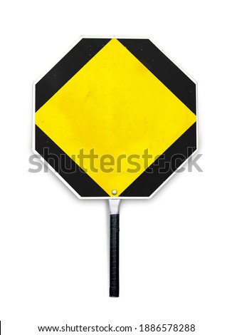 Blank yellow stop sign used for traffic control by crossing guards, police or work zones. Octagon hand-held paddle stop sign template or mockup. Aged metal texture sign in  shape. Isolated on white.